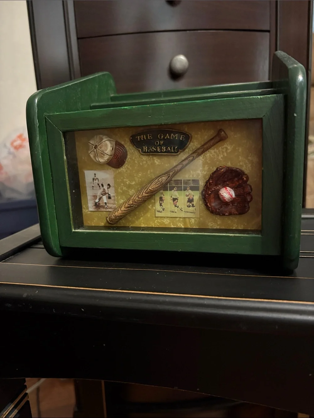 Green Baseball Themed Decorative Box Holds Channel Changers and Phones.